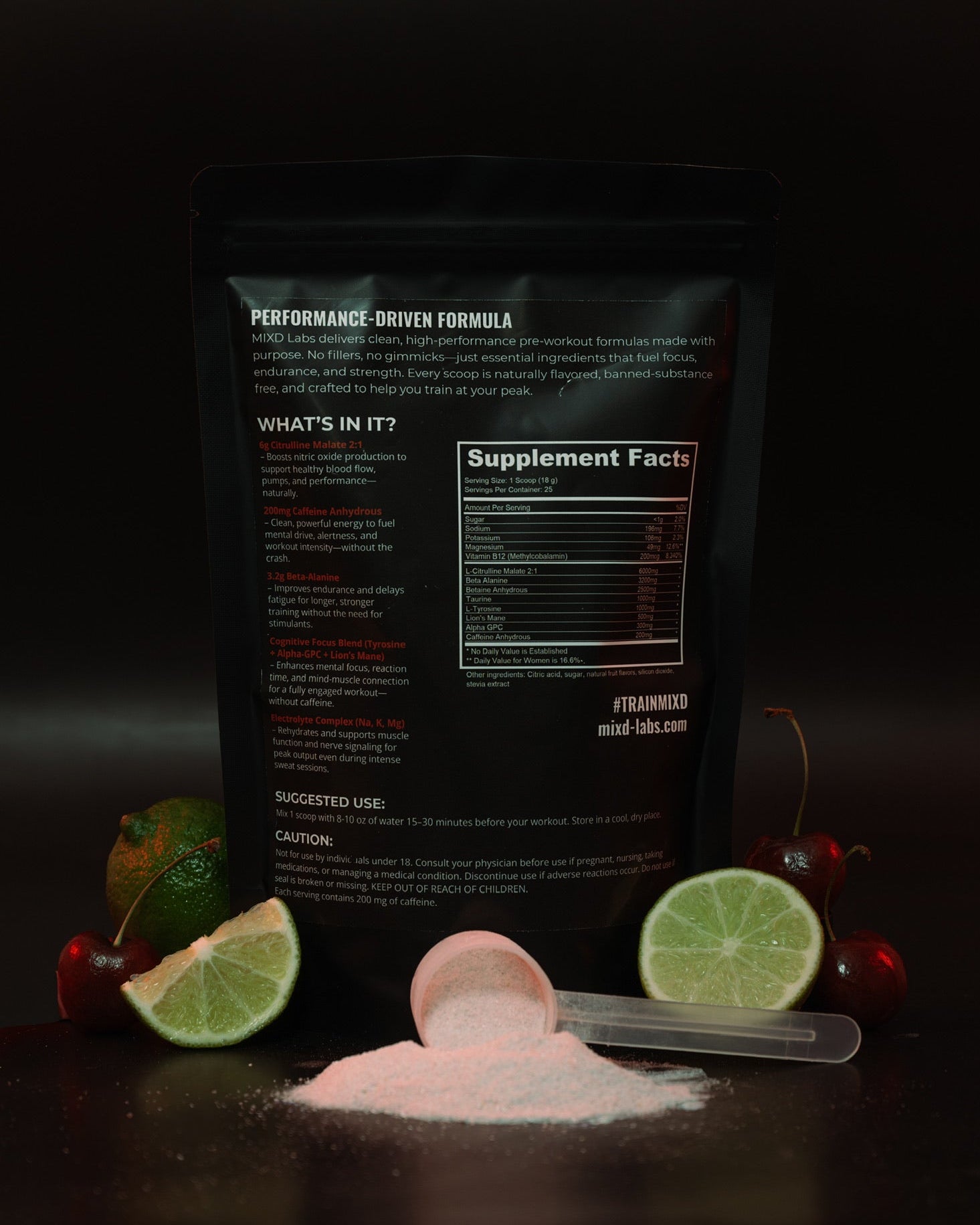 Supplement package with lime slices and a scoop of powder on a dark background
