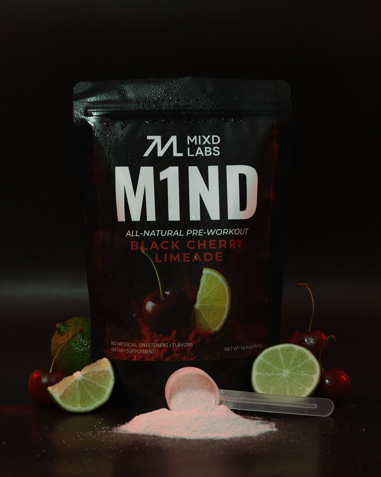 M1ND pre-workout supplement packaging with lime and cherry elements on a dark background