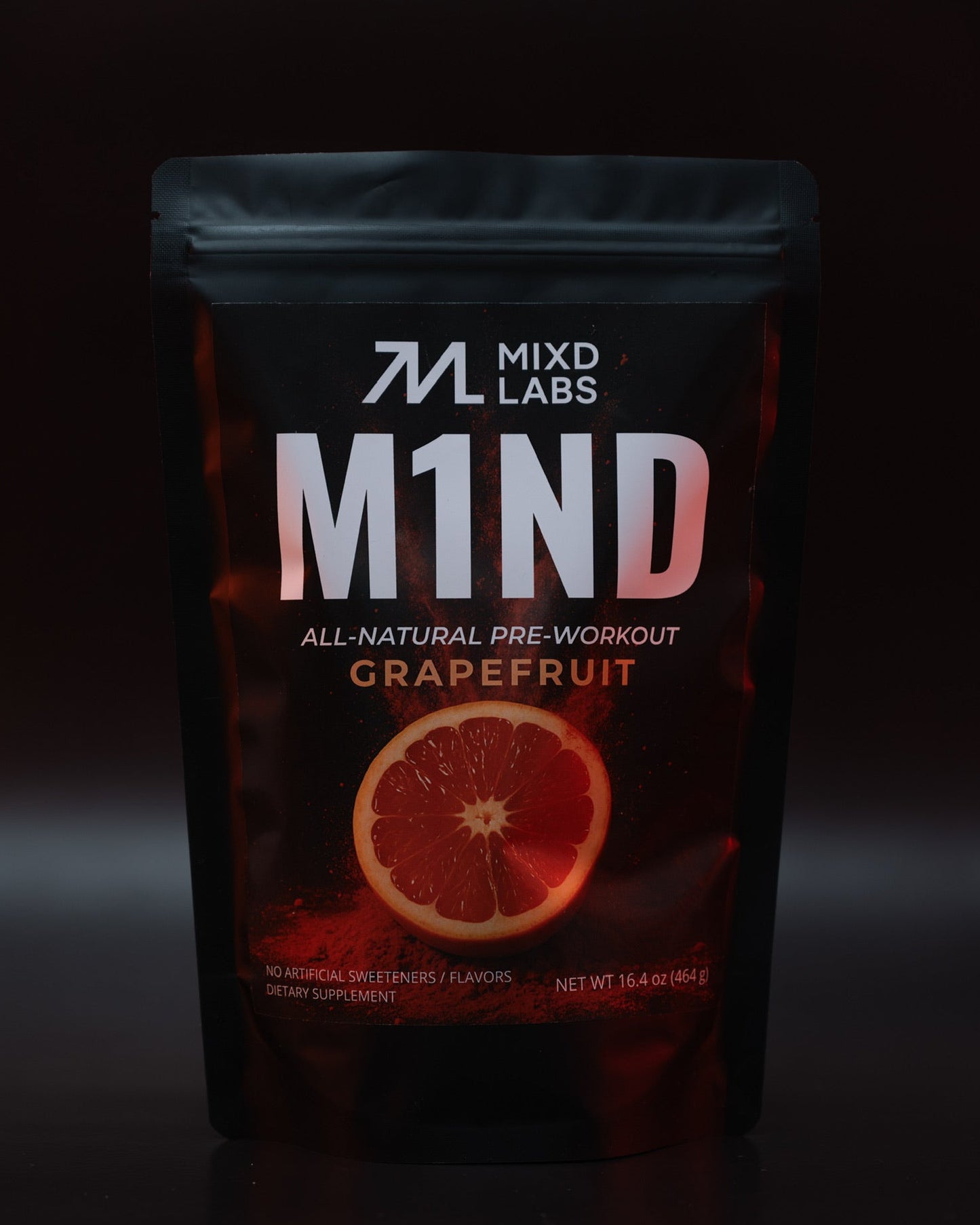 M1ND all-natural pre-workout grapefruit supplement packaging on a dark background