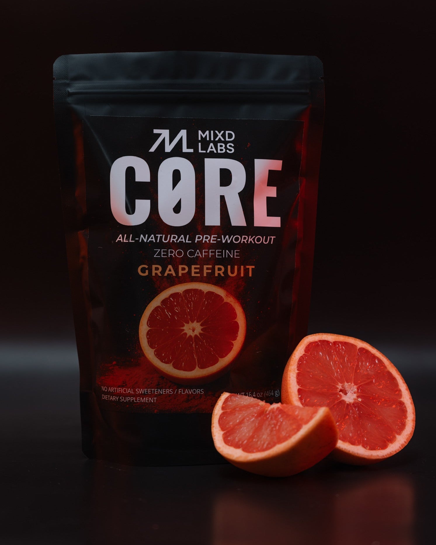 MIXD LABS CORE pre-workout supplement package with grapefruit slices on a dark background